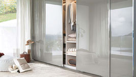 Custom design modern closet with glass sliding doors