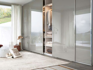 Custom design modern closet with glass sliding doors