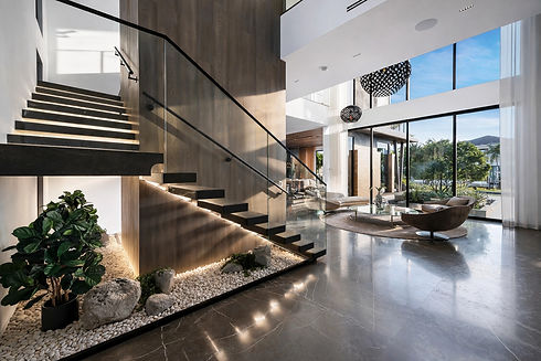 VelArt modern open-concept living space with staircase remodeling by VelArt, South Florida