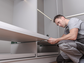 Service technician installing custom closet