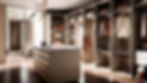 Luxurious walk-in closet with beige and brown tones. Shelves display bags, shoes, and suits. An island counter is centered. Cozy ambiance.