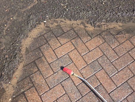 moss and dirt being removed from a driveway in Draycott, Derby