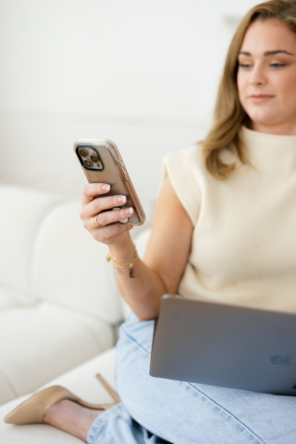 Close-up of a woman’s hand holding a smartphone with a clear case. | Digital communication, social media management,