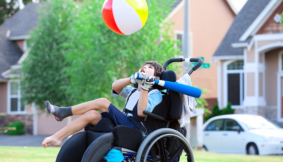 Boy in wheelchair with baseball bat & ball.jpeg