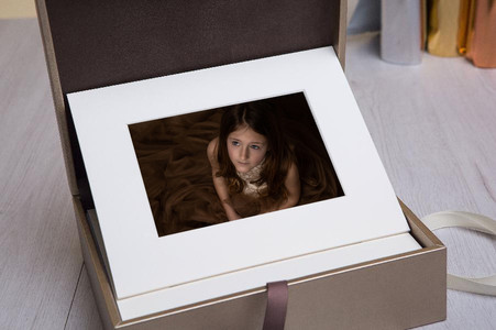 Luxury folio box with matted print of a young girl