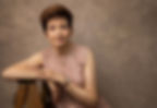 Studio portrait of a beautiful woman with pink dress