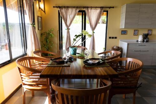 The Lucky House Fare Manuia in Bora Bora, a casual poolside restaurant and bar with open‑air seating, wood‑fired pizza oven, tropical cocktails, and lagoon‑inspired décor.