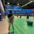 badminton coach teaching a badminton lesson