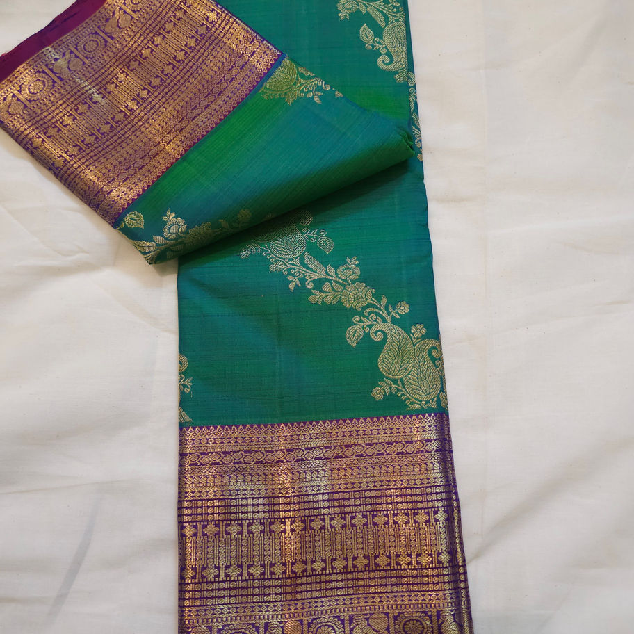 Green and violet bridal kodi Kanchipuram saree