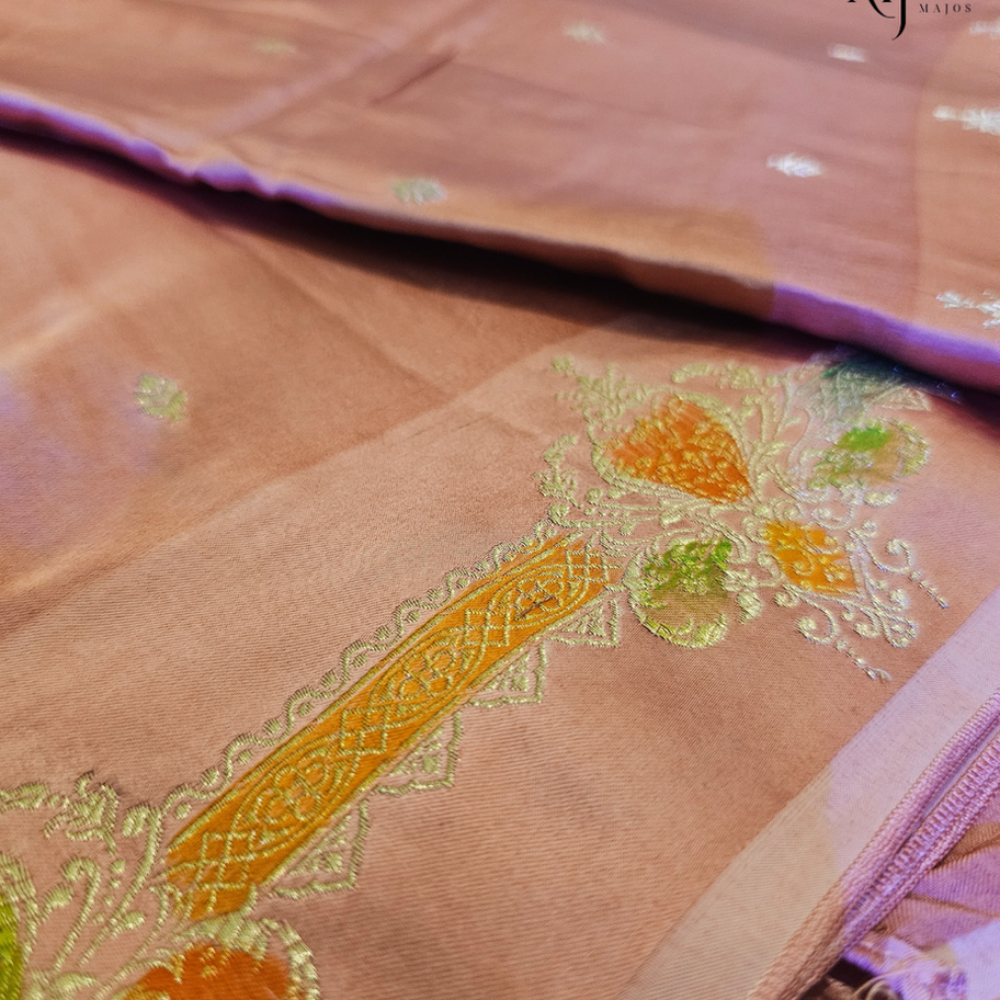 Close-up of pastel nude Mashru Mena Silk fabric with embroidery