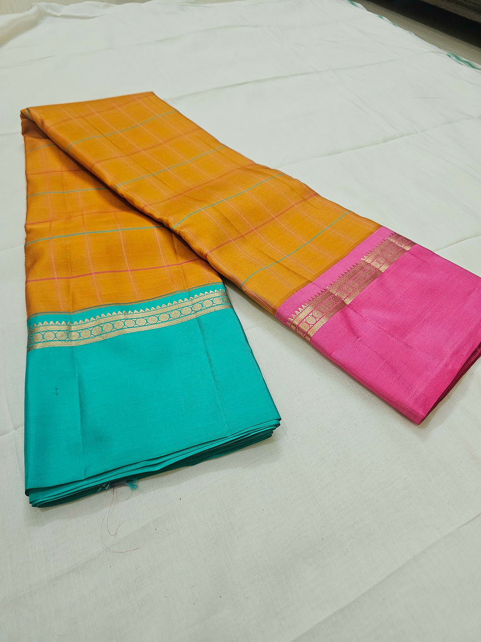 Folded mustard pure soft silk saree with ganga jamuna border