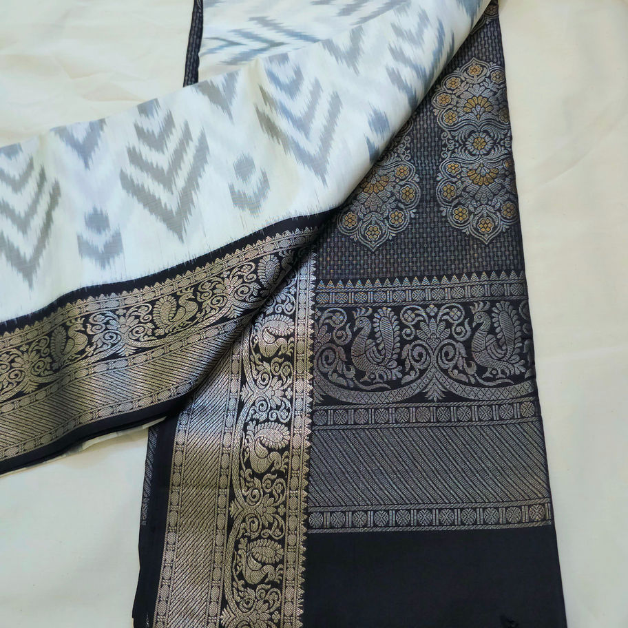 White and black Pochampally Ikat saree with zari border