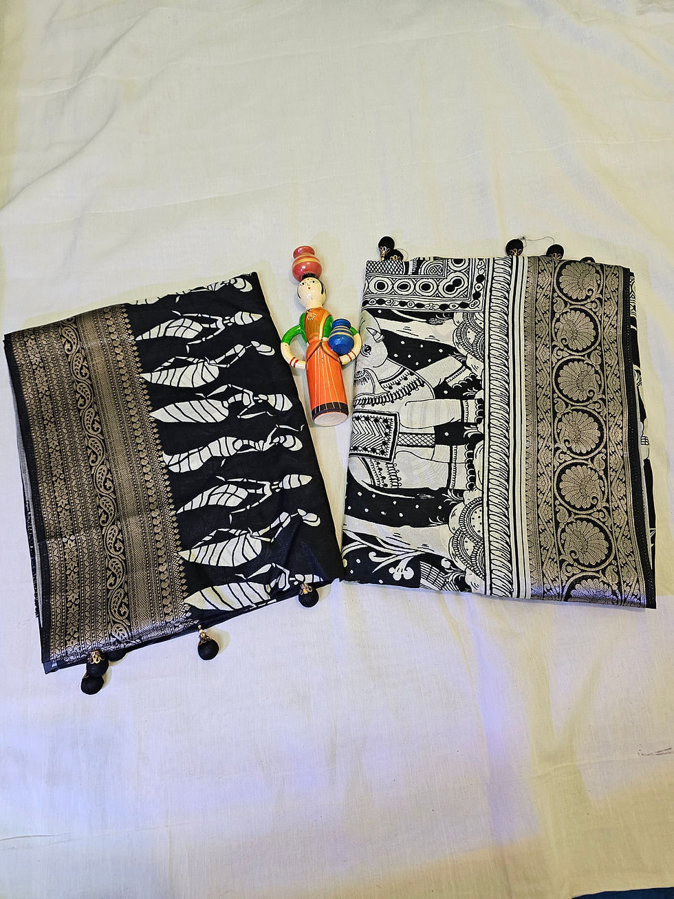 Folded A29-ALL ADHIRA-253 sarees with traditional prints