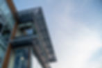 Exterior of a modern industrial building against blue sky