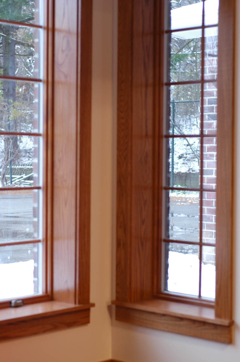 Wooden framed corner windows looking out to snow