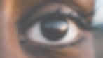 Close-up of black woman's left eye with a horizon in background.jpg