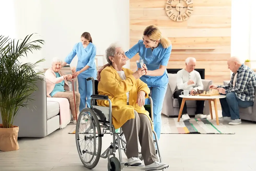 A nurse talking to an elderly women in a wheelchair in a nursing home.