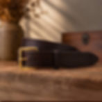 Close-up of handmade vegetable tanned leather belt with brass buckle