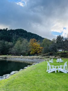 Hills, water, white chairs