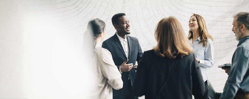 Global workforce team collaborating in a modern office, representing PZI Group’s integrated Talent Globalization® model.