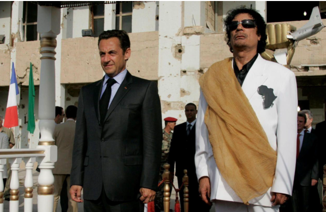 Nicolas Sarkozy and Mouammar Gaddafi 2007 (Photo Credit: RFI.fr REUTERS/Pascal Rossignol)