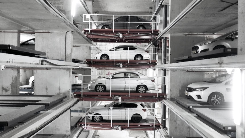 Robotic Parking dydtem with cars parked on moving conveyors