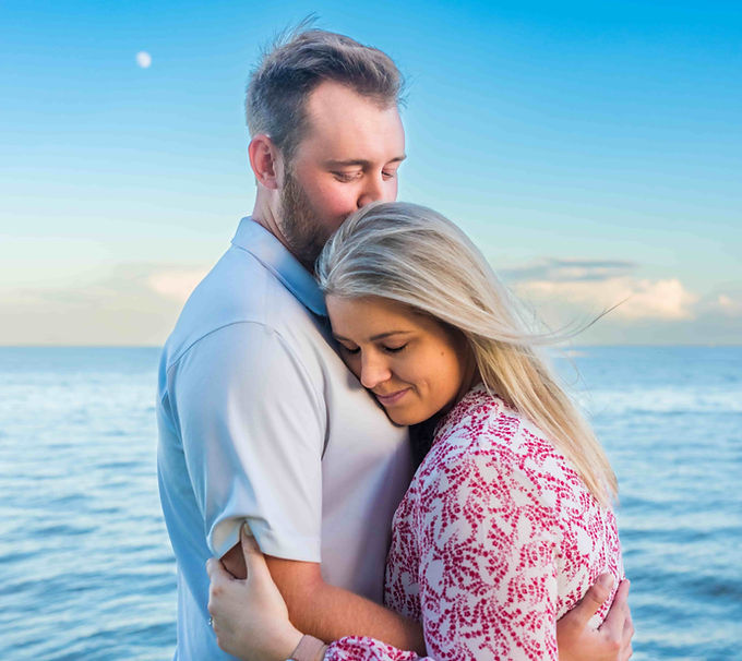 tampa engagement photography session with hte moon behind them