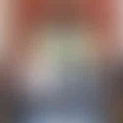 A newlywed couple share their first kiss in front of the feature window at Brig o' Doon House Hotel