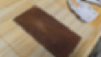 Corten steel plate after heavy abrasion with P80 grit showing bright metal scratches and scars