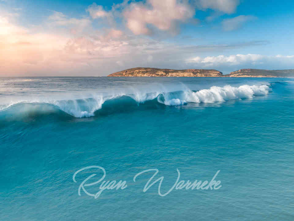 Blue curling wave crashing in Plettenberg Bay South Africa