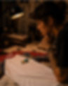 a tattooed woman looking at the original graphic artwork printed on a ROCKEN raglan shirt