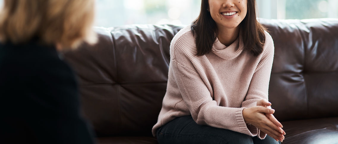 woman-smiling-during-meeting-on-brown-leather-couc-2026-03-25-01-47-27-utc_edited.jpg