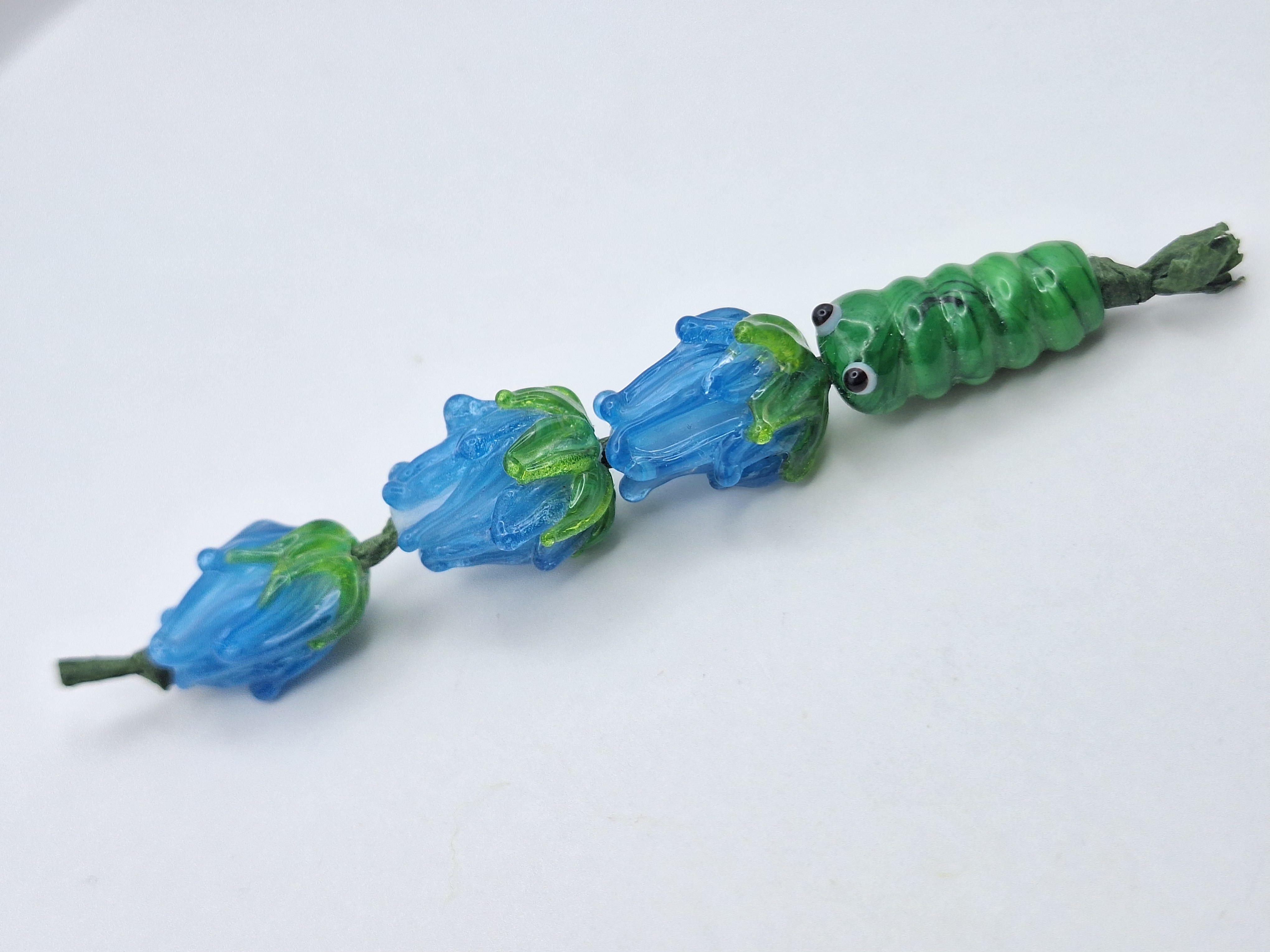 Three Blue Flower Beads and Caterpillar 