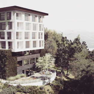 Commercial architectural rendering of a multi-story building on a wooded slope. By Black Cabin.