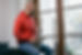 Venezuelan latino musician man, at home sitting on the sofa in the living room next to the