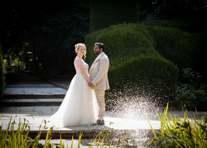 Bride and groom at Lympne safari park fountain