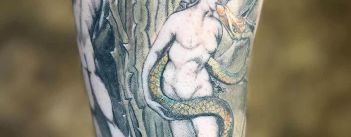 Full-color realism tattoo replicating William Blake’s iconic painting The Fall of Adam and Eve, featuring intricate details and lifelike shading. This custom tattoo captures the powerful biblical moment of temptation and the consequences of humanity's first sin, beautifully translated from canvas to skin with vivid color and deep symbolism.