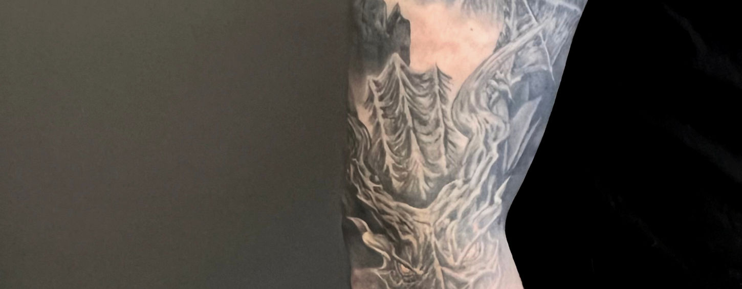 Full-color sleeve tattoo inspired by the visually stimulating world of Skyrim, showcasing key elements of the game’s epic lore. This custom tattoo brings to life detailed scenes, characters, and symbols from the fantasy universe, combining vibrant color and intricate realism to capture the essence of adventure, mythology, and heroism.