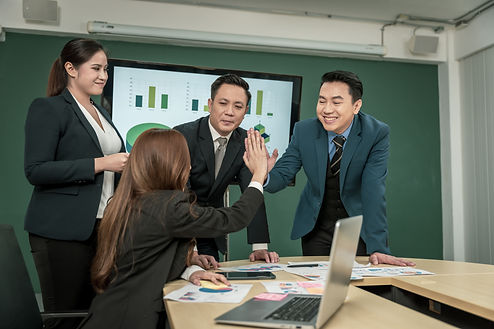 smiling-professionals-high-five-in-a-bright-office-2026-03-24-00-36-42-utc (1).jpg