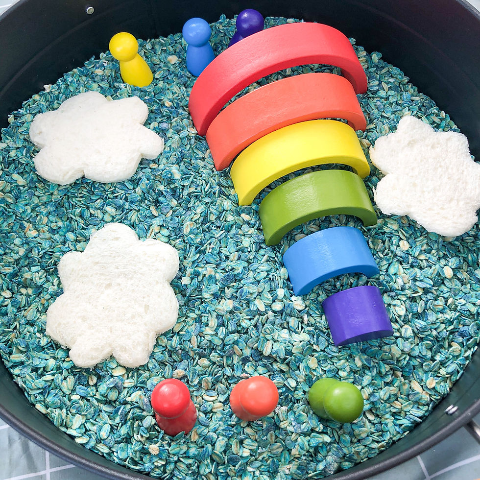 Rainbow wooden blocks and bread clouds in sensory bin
