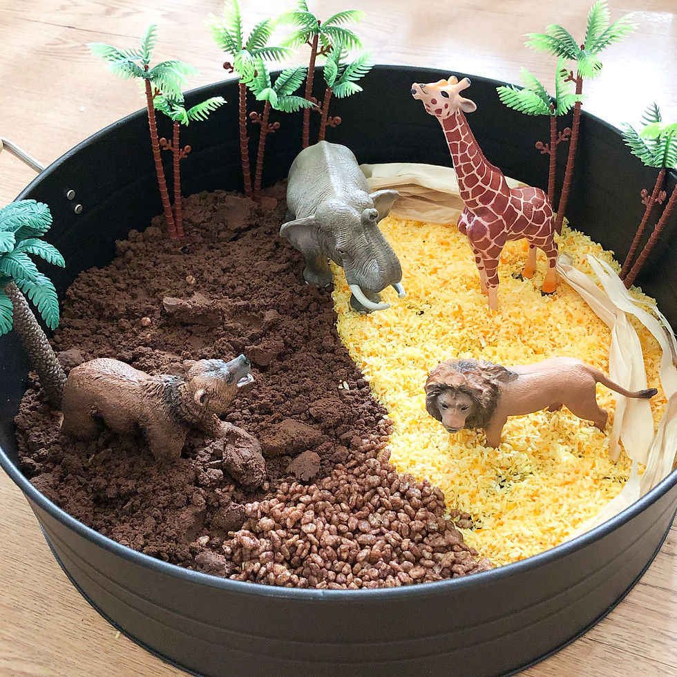 Safari animal toys in a sensory bin