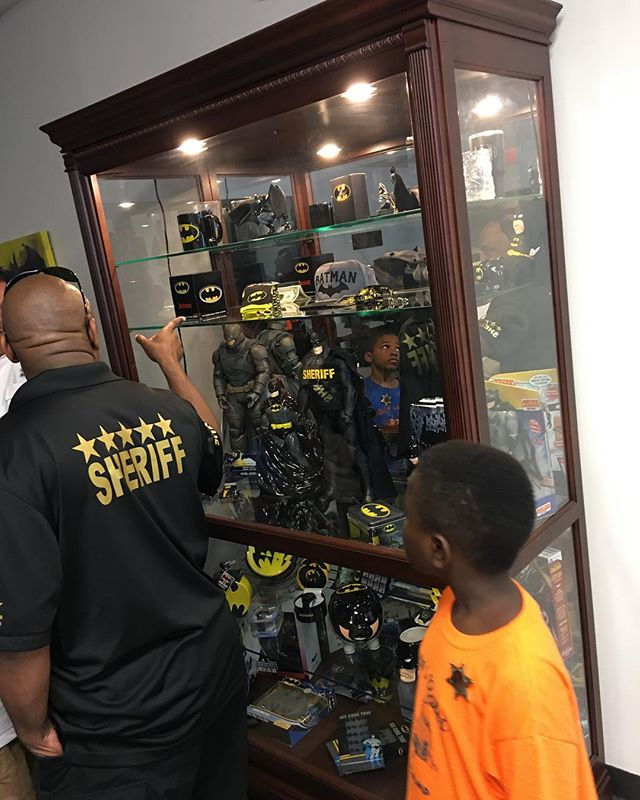 The sheriff showing off his Batman colle