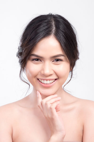 A confident model with a sleek jawline, illustrating the permanent fat reduction achieved after a full Kybella treatment plan