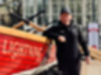 Close up of a gig club member leaning against a gig boat