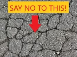 Cracked driveway from roll off dumpster damage say yes to junk bus dumpter rental on wheels