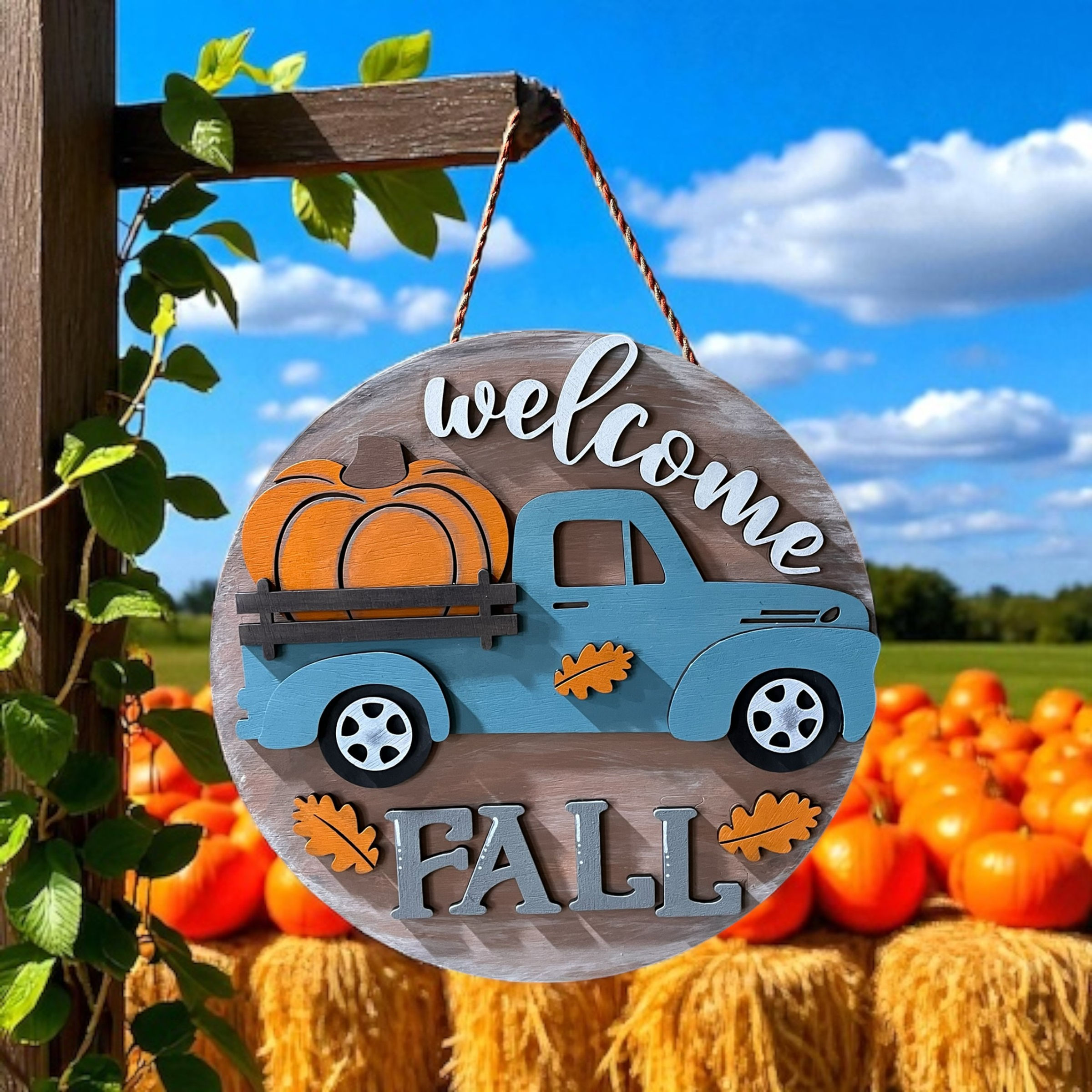 Finished farmhouse fall door hanger with vintage truck and pumpkins