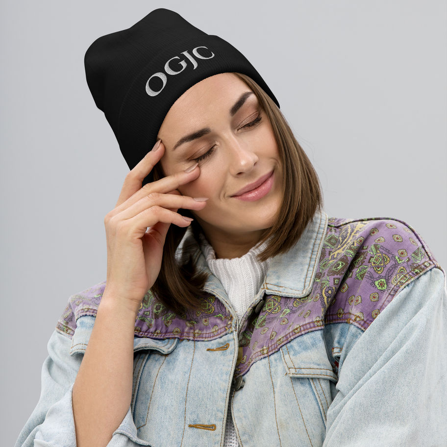 Image of a woman wearing a black embroidered OGJC Ministries beanie