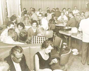 No social distancing here! Bernard’s Surf on a typical night, packed to the rafters and lined with hungry guests! [Photo Credit: Author’s Collection]