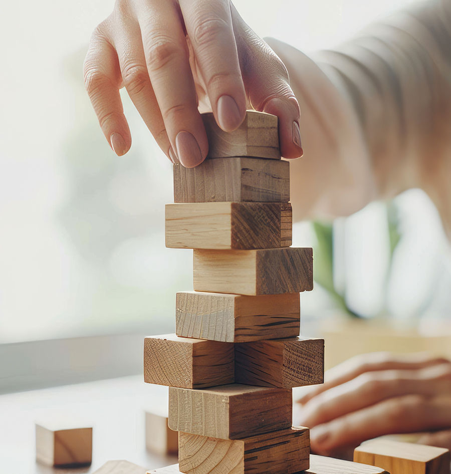 Woman stacking wooden blocks