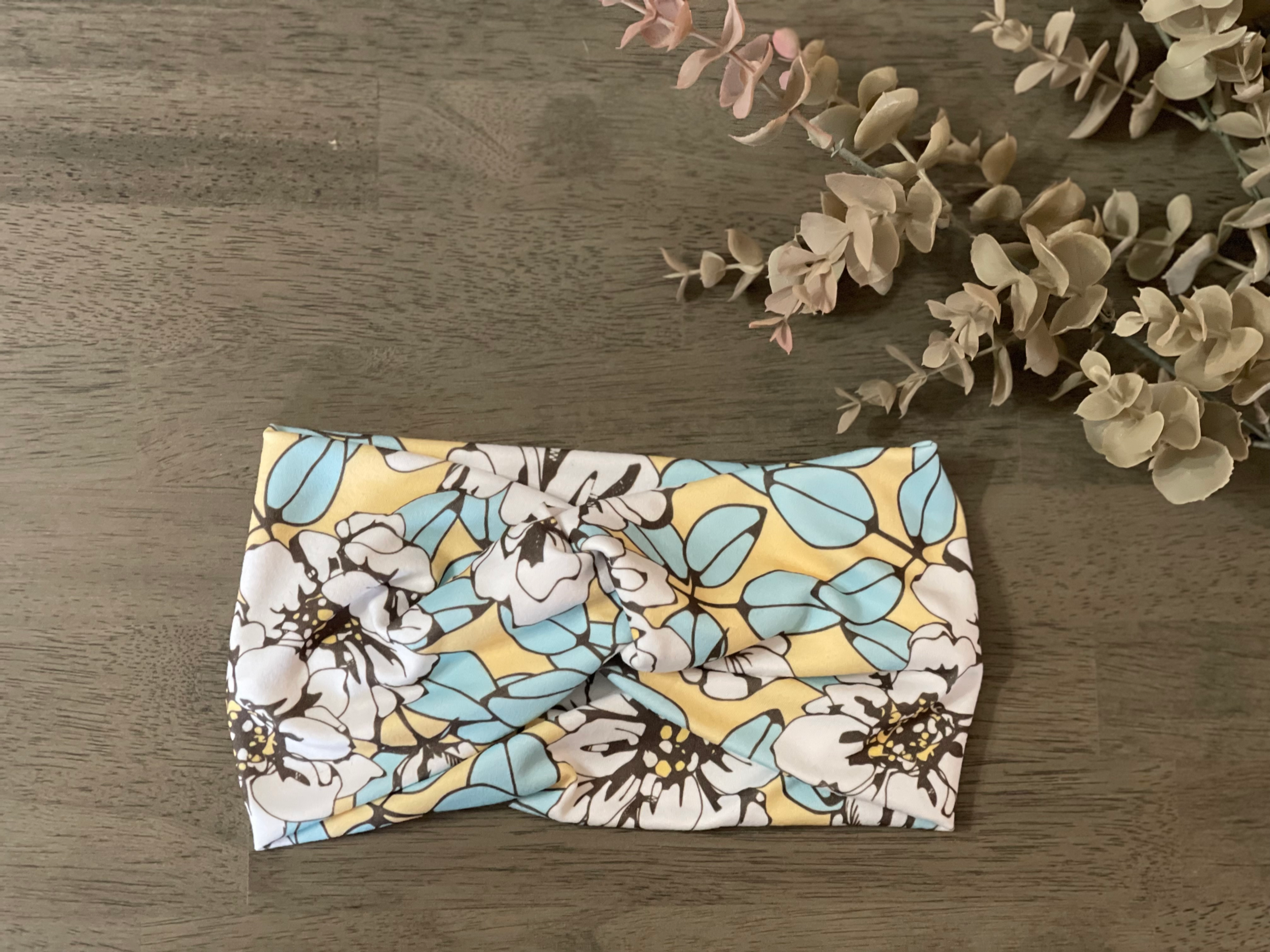 White flower on yellow twist headband
